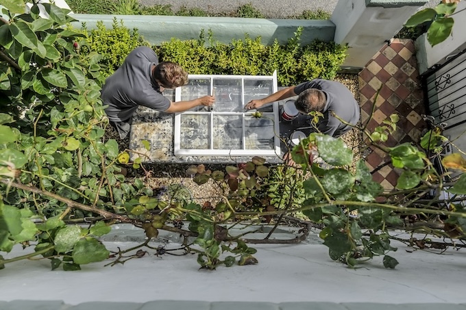 craftspeople preparing a new window